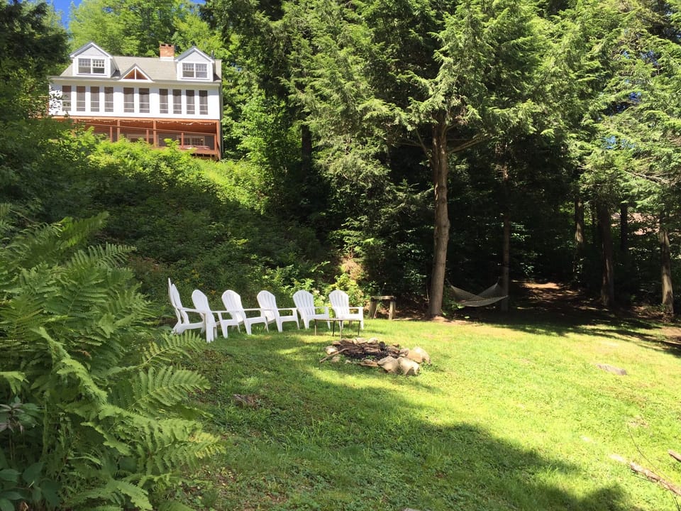 Lakefront lawn area with fire-pit 