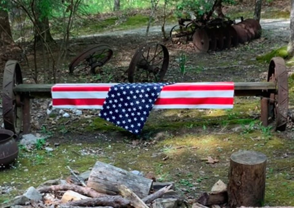 Fire pit within circle driveway, view from front porch walkway