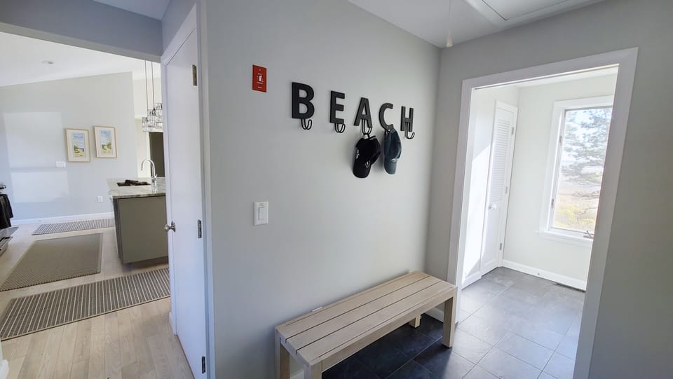 Main level entry way with kitchen beyond