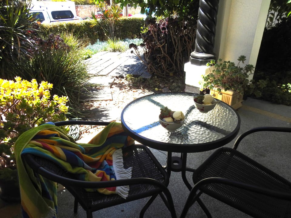 Front porch can be accessed from bedroom 1. Outdoor shower for sandy feet.