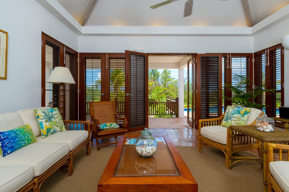 Coconut Palm Villa with French Doors Opening Onto Pool Deck