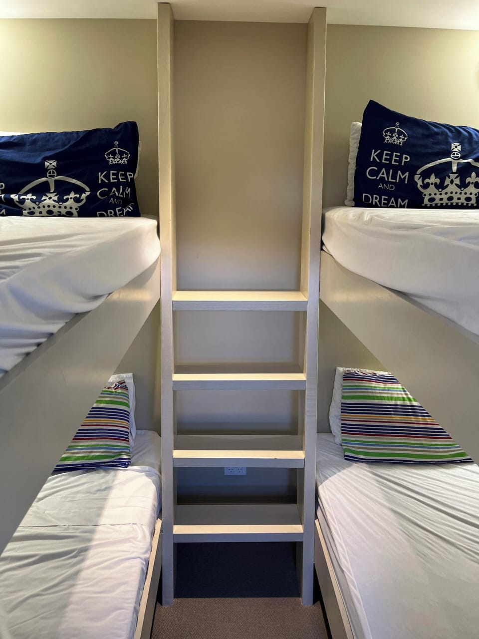 Bunkroom with 4 sturdy single bunks with reading lights 