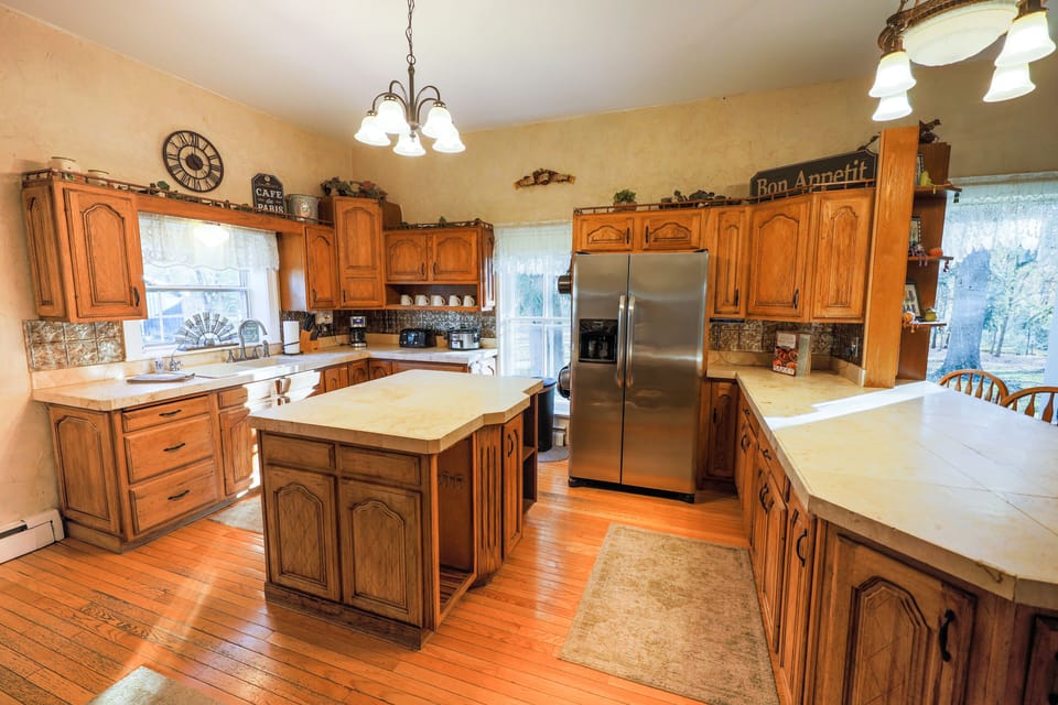 Large kitchen with commercial oven/range and ample counter space