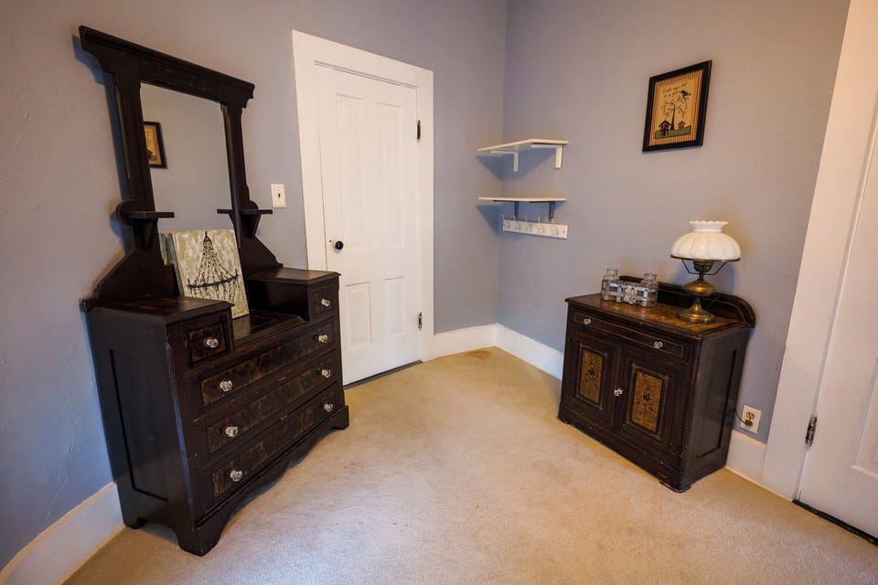 East bedroom with a twin over full size bunk.