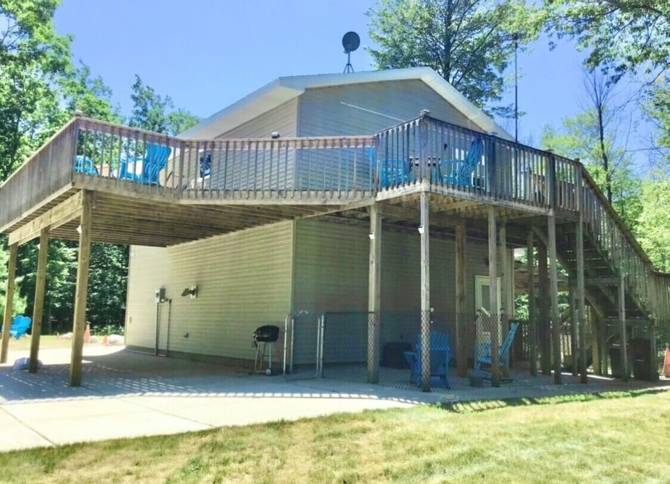Fenced in shaded area under large deck with fenced in area under deck 