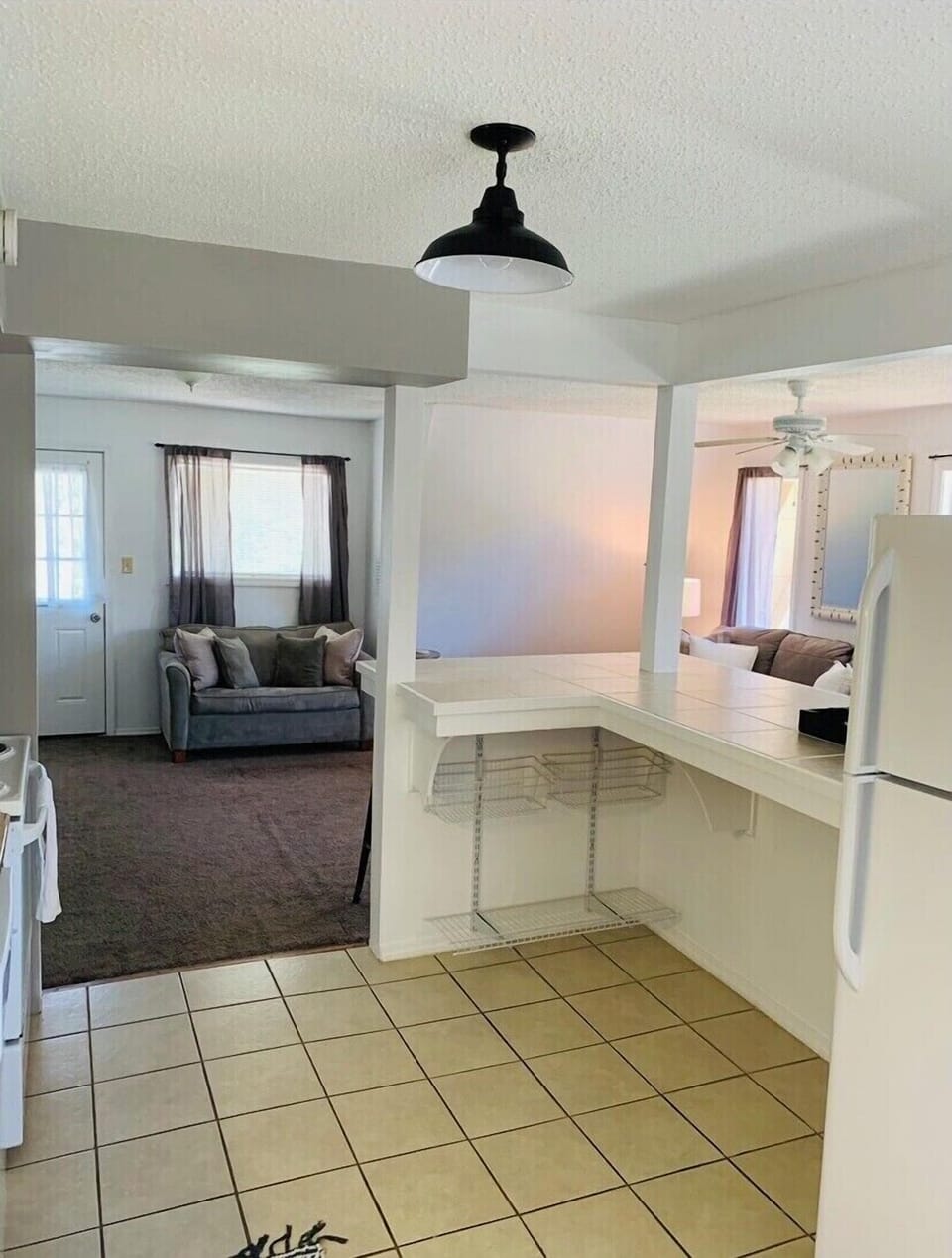 Large bar seating for 4 adults. Food storage under the bar.