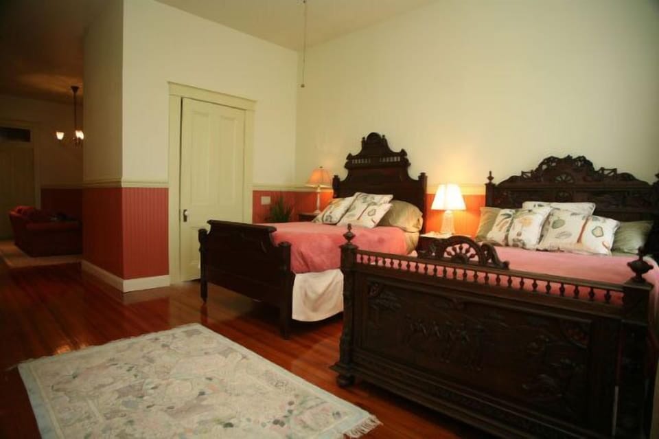The Magnolia Suite with two full size beds and semi private balcony