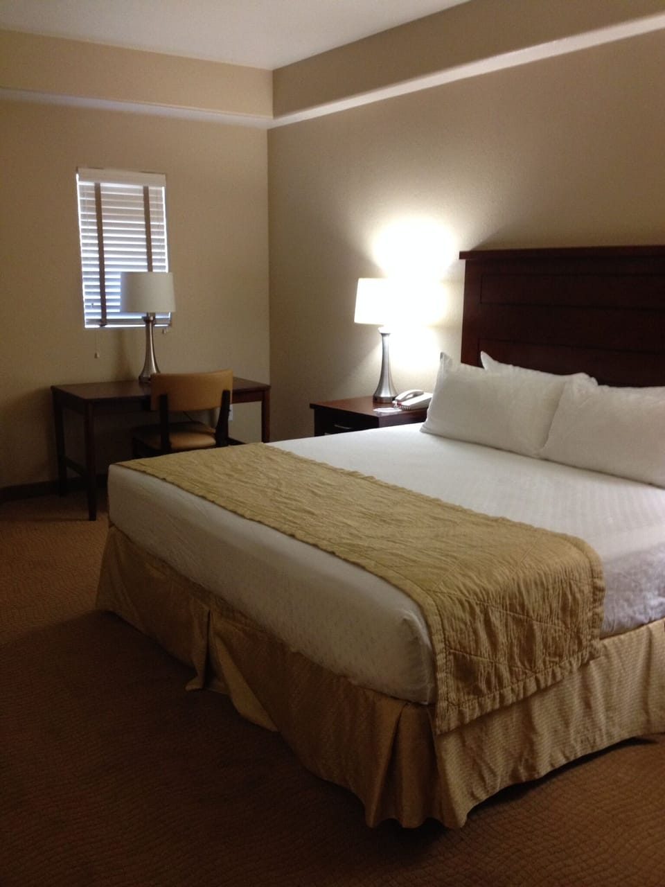 Spacious 2nd BR deluxe suite with king bed, premium mattress, and large desk