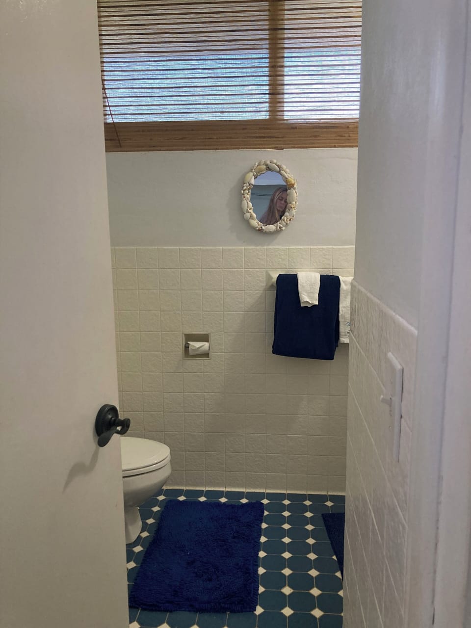 full bathroom with indoor and outdoor showers and separate vanity area 