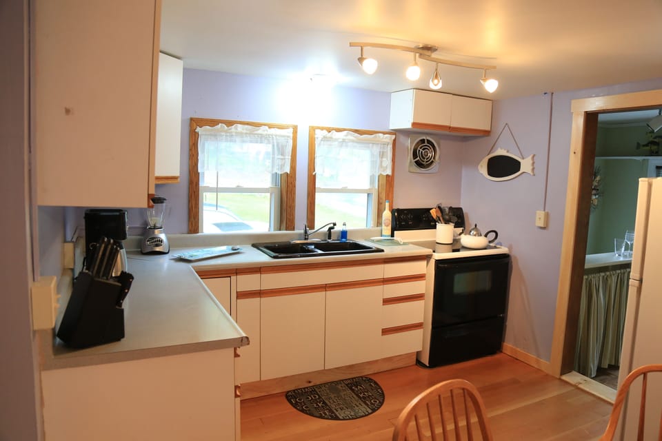 Fully Equipped Kitchen. Pots, pans, utensils, glassware, blender, coffee pot