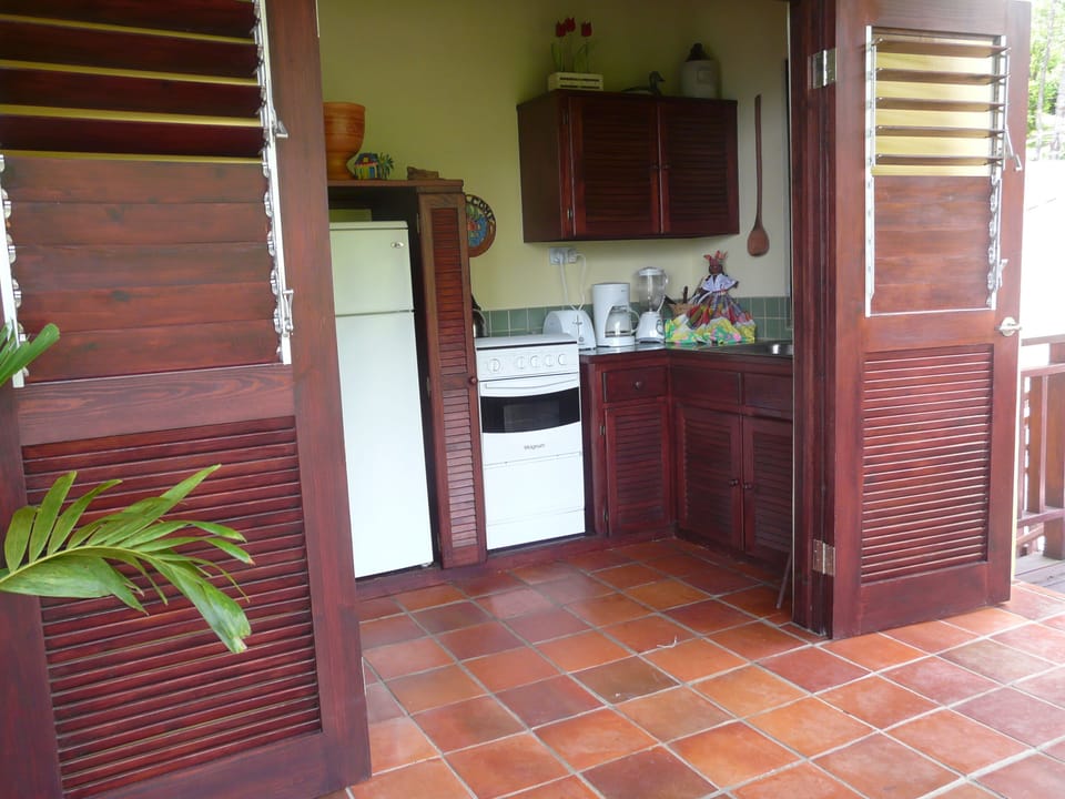 Well equipped kitchen  with full stove,  fridge and all the needed utensils