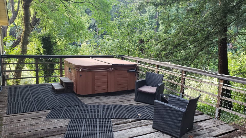 Hot tub on side deck with river views.