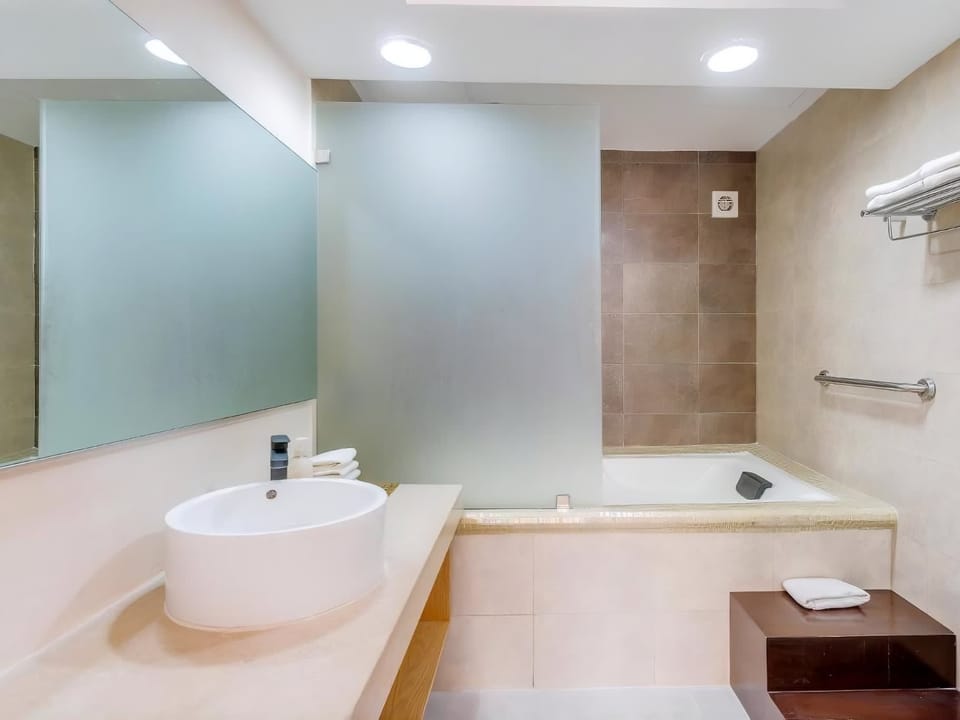 Full bathroom with a bathtub and a vessel sink.