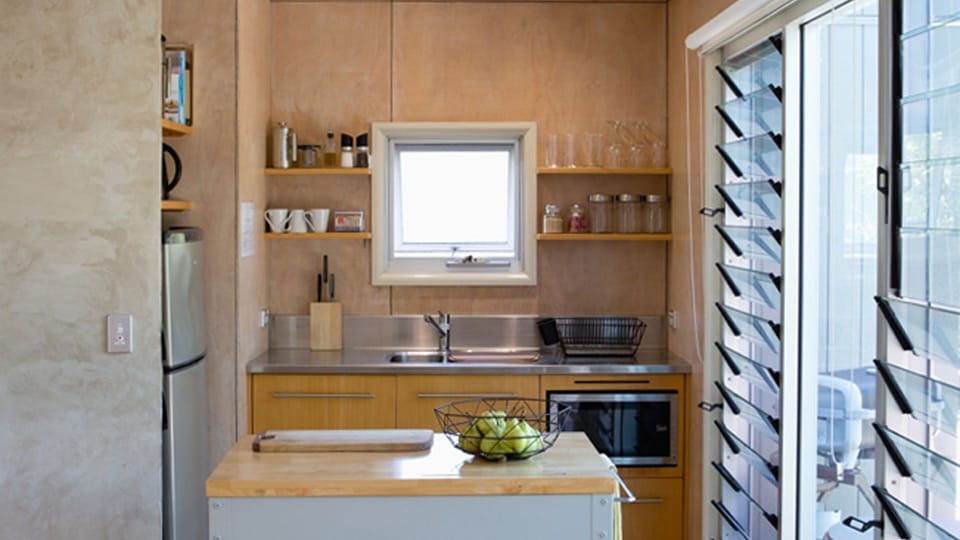 Quality appliances and cookware in a small but functional kitchen