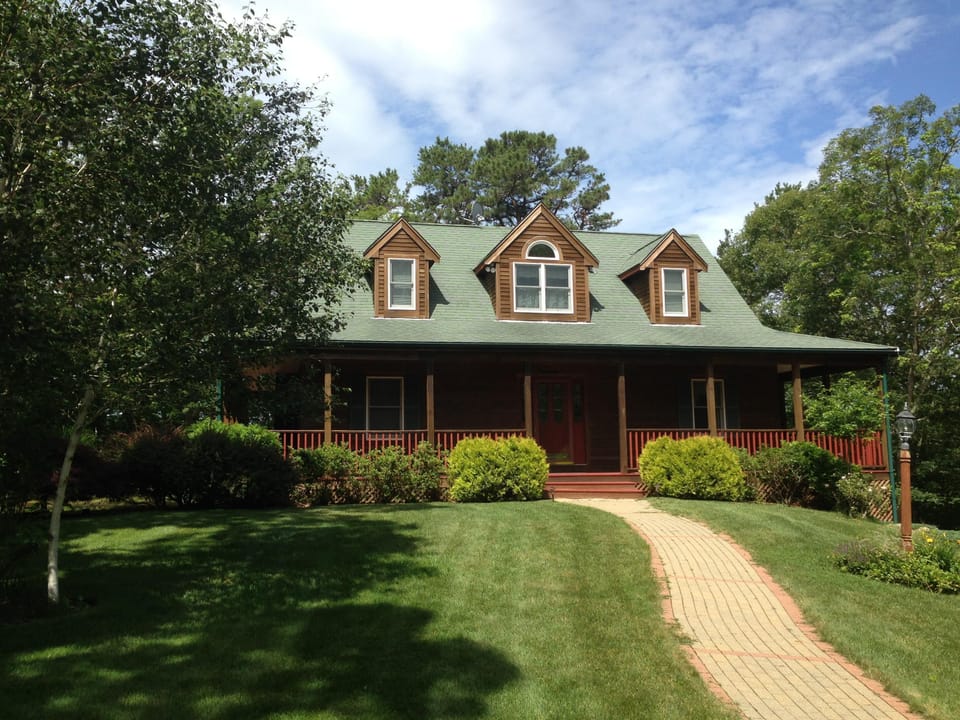 Serene spacious house with a wraparound porch and central AC, custom built