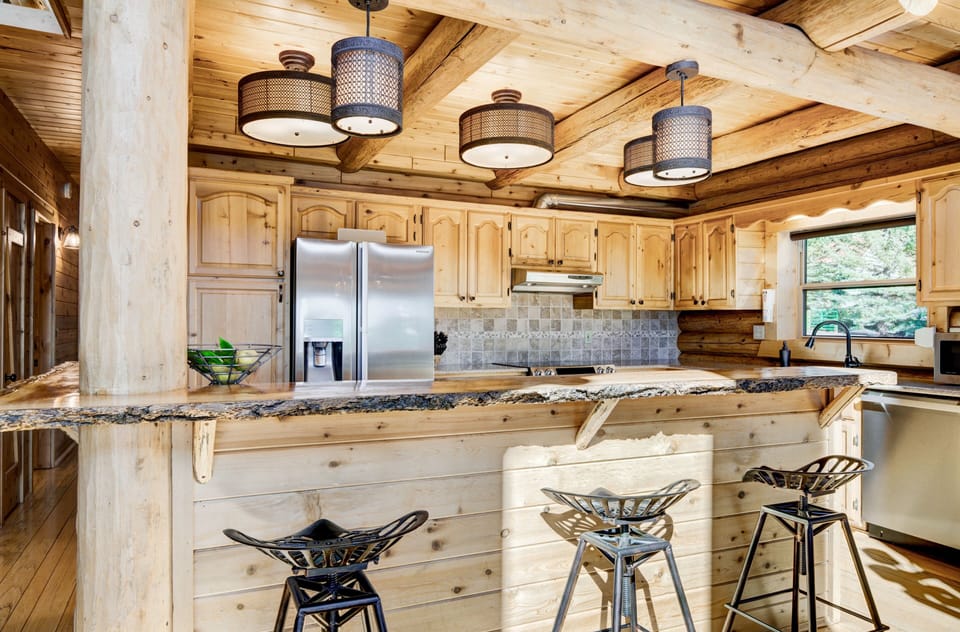 ..Live edge bar, custom designer lighting throughout the entire lodge.