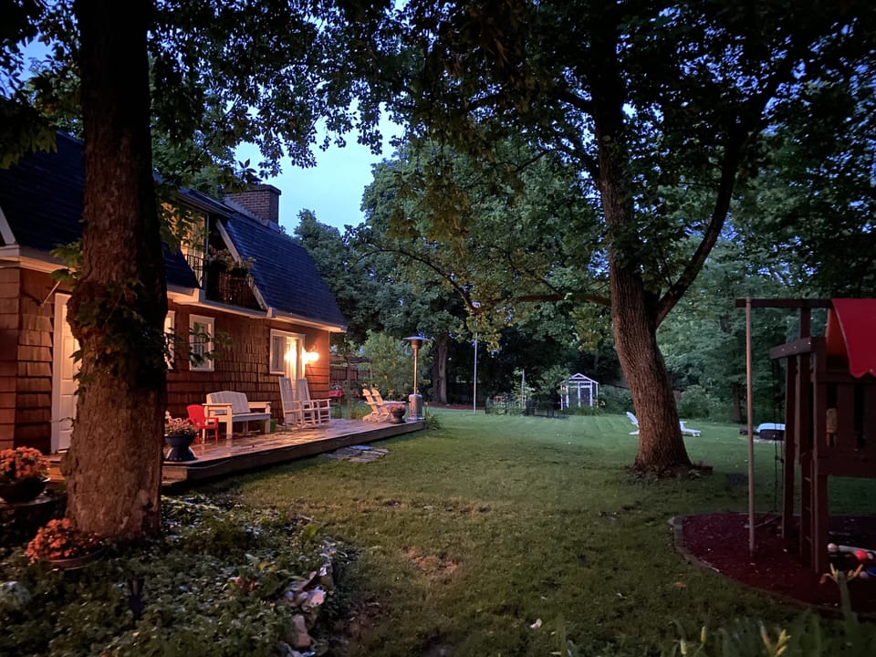 Exterior of cozy coach house deck and back yard.
