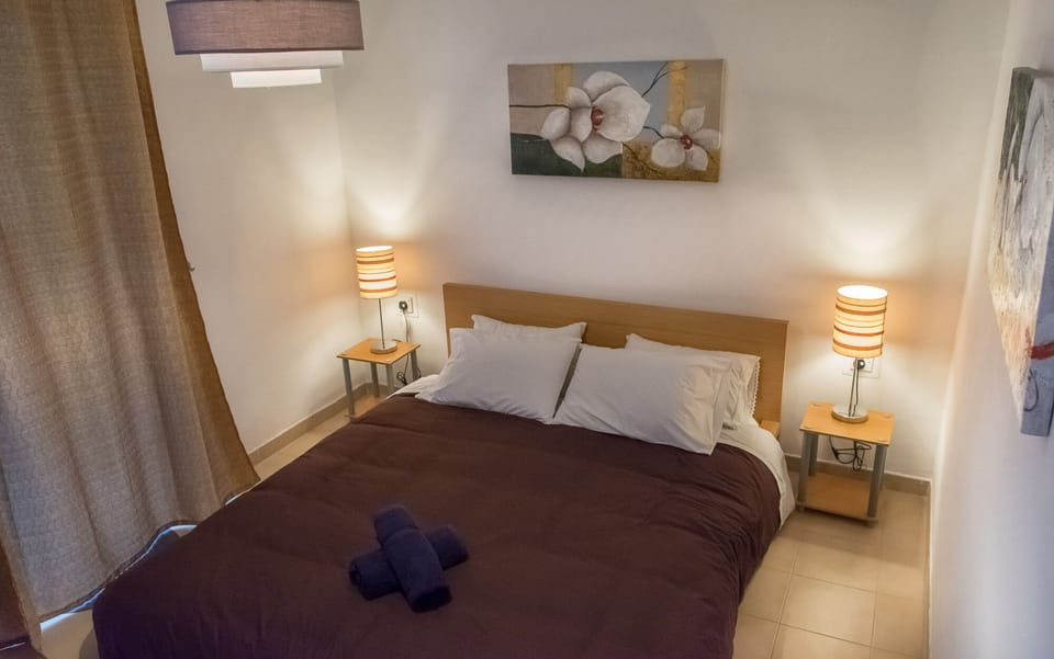 Main bedroom with outdoor terrace adjacent to it with coffee table