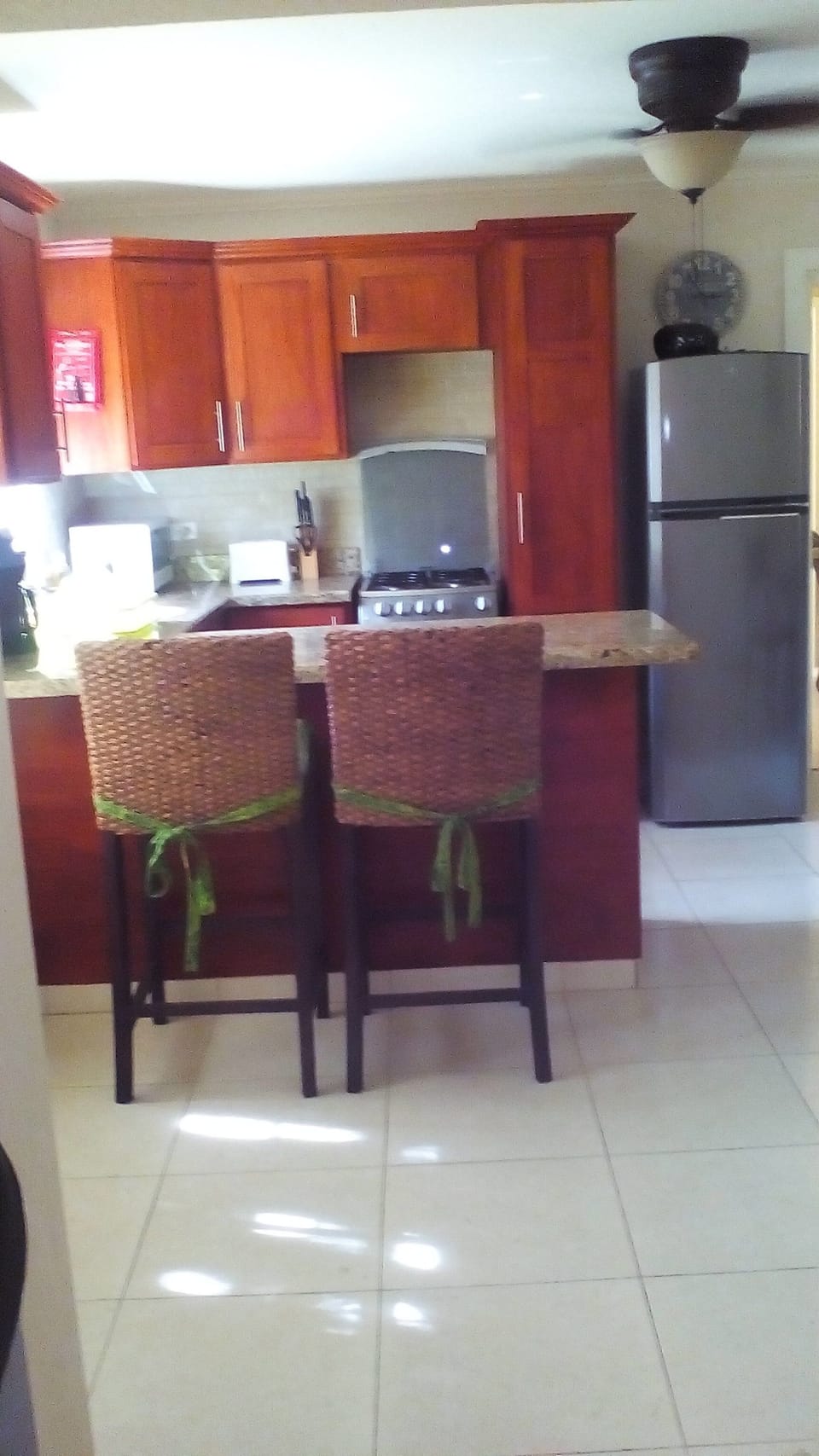 Well equipped kitchen with granite counter-tops and breakfast bar/work station.