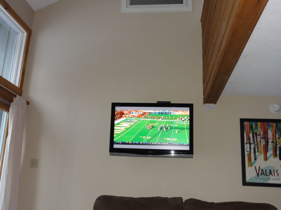 This photo does not reflect the new 55' LED TV to catch the game! High Ceilings