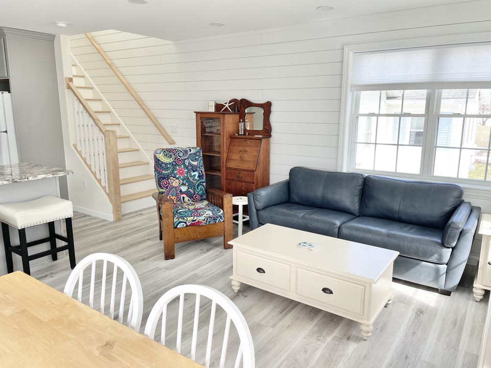 Leather Couch, Easy Chair.  Stairs to 2nd Floor.