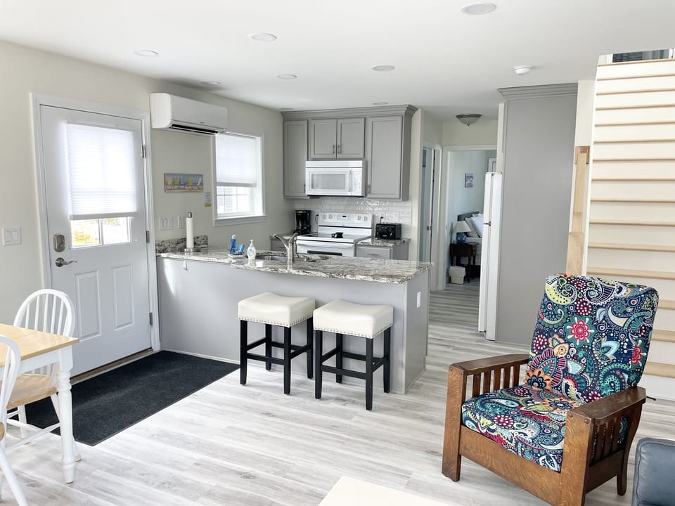 Kitchen with counter bar seating in the Open Living Space.