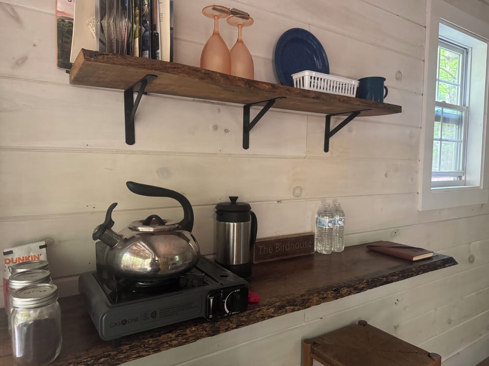 Butane Burner, Teapot, French Press, Places settings for two.