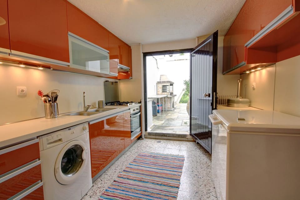 Downstairs Kitchen w/ Barbeque set up outside