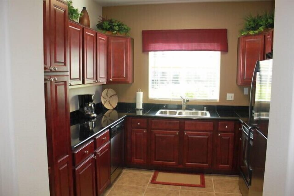 Spacious kitchen with granite counters and stainless appliances.