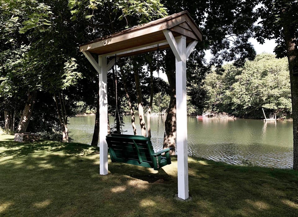 Relax in the swing with a glass of wine while watching the swans and geese