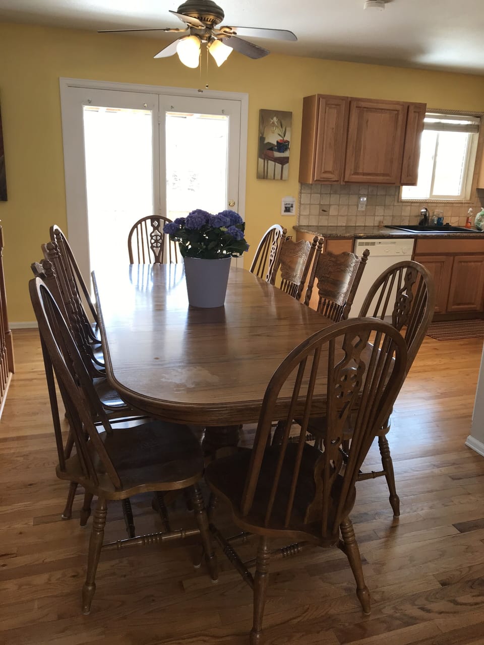 8 foot dining room table sits 10 to 12 people comfortably.