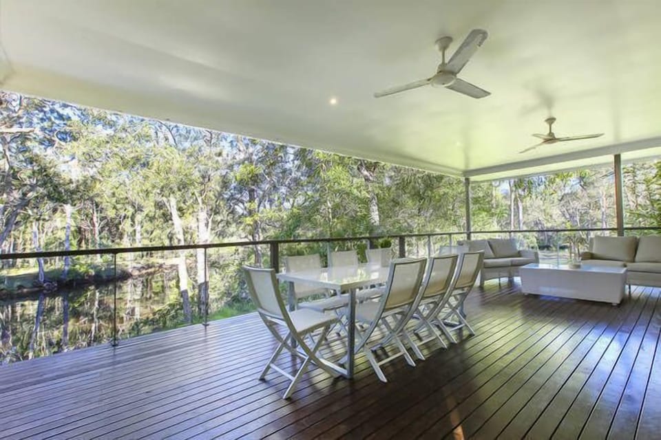 The deck is under the roofline with really comfortable lounges and dining