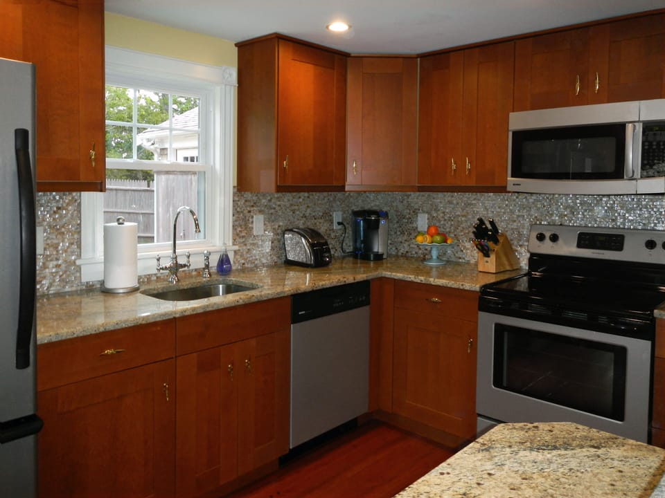 All-new kitchen has modern appliances and finishes, including granite counters