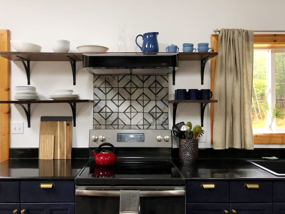 Handmade Tile Backsplash, Cooktop with Vent. 