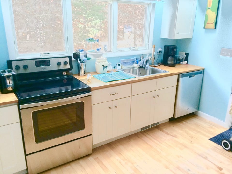 Kitchen with new range and dishwasher 