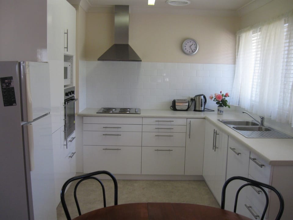 New kitchen with dishwasher, cooktop, microwave and oven