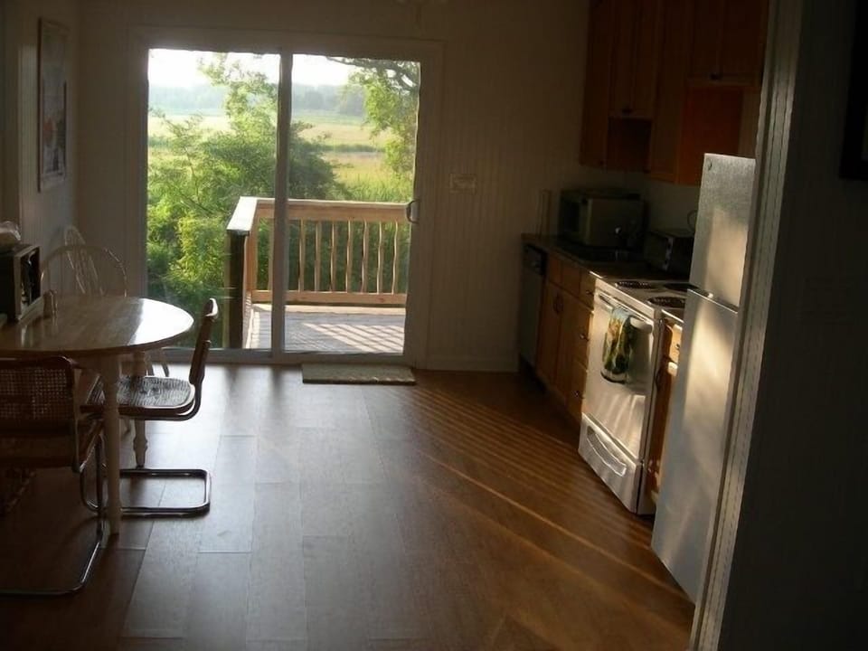 Full Kitchen with new refrigerator, dishwasher, etc., step out to deck