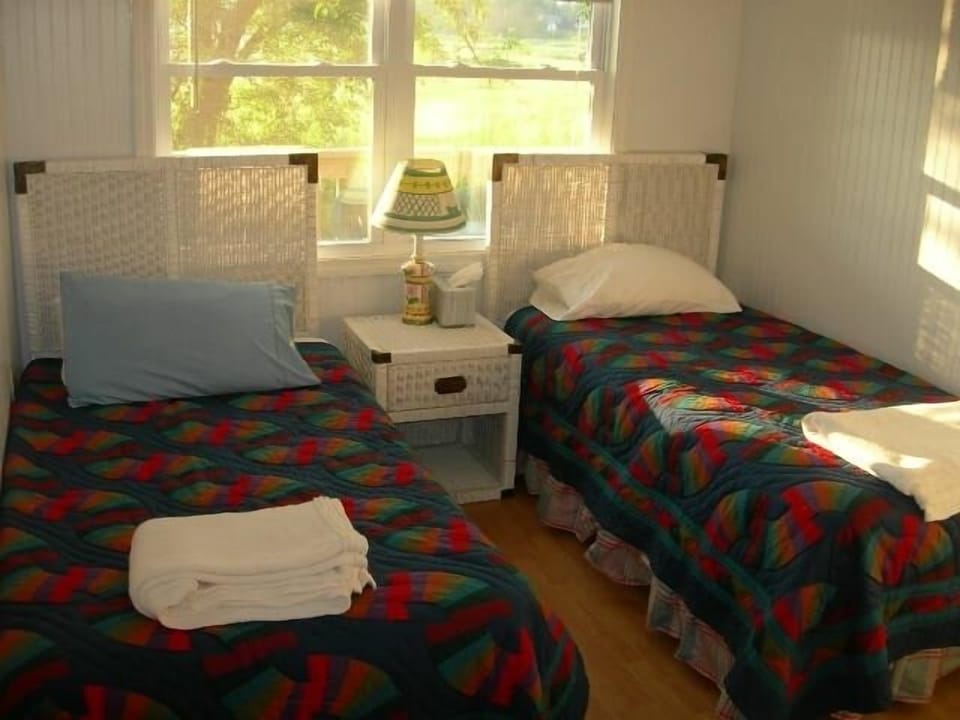 Twin Bedroom with nightstand, dresser and closet