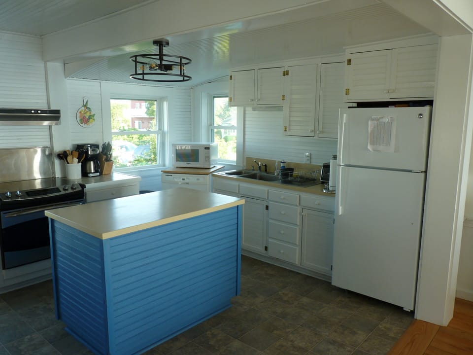 Kitchen with view of ocean to the right and marsh to the left.