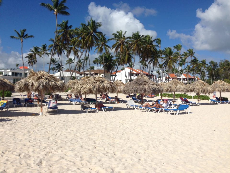 Los Corales Beach with sun lounges and a palapa reserved for you!