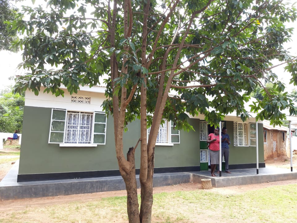 Front Viw, with refreshing cool compound under mango or orange trees.