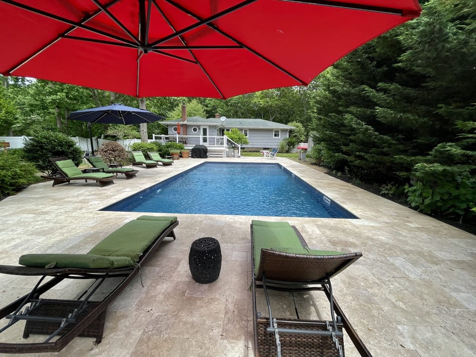 Pool with main house in the background
