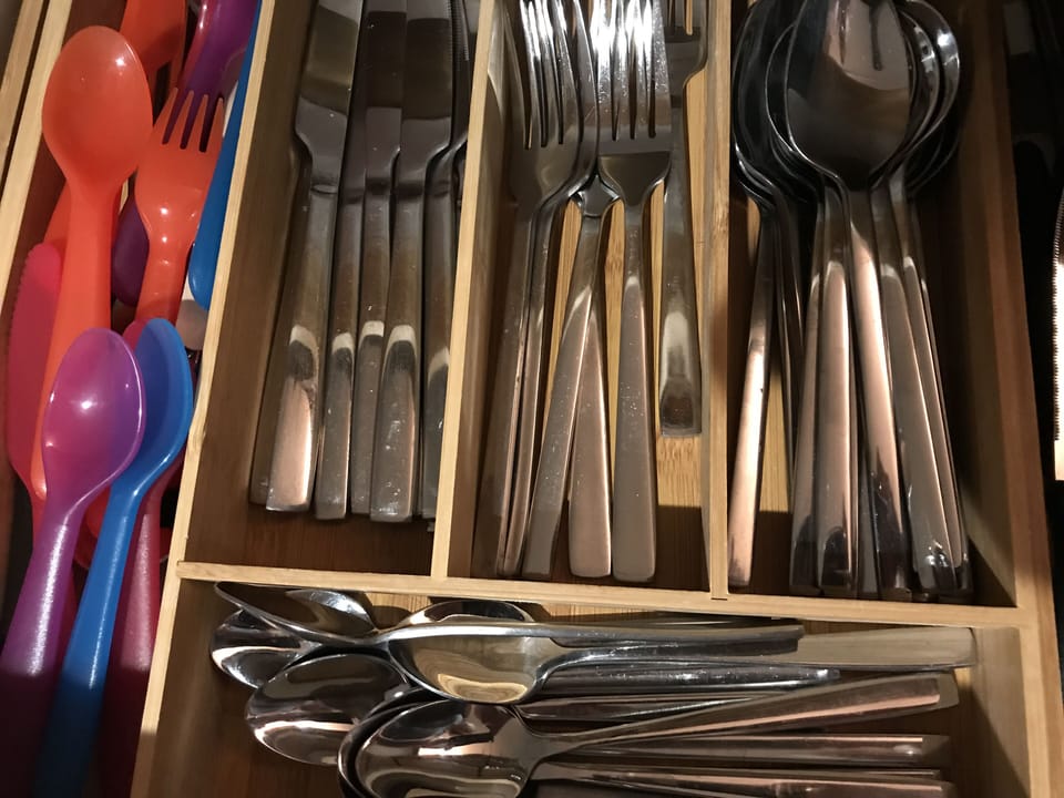 Well equipped kitchen including child friendly cutlery, plates, bowls and cups.