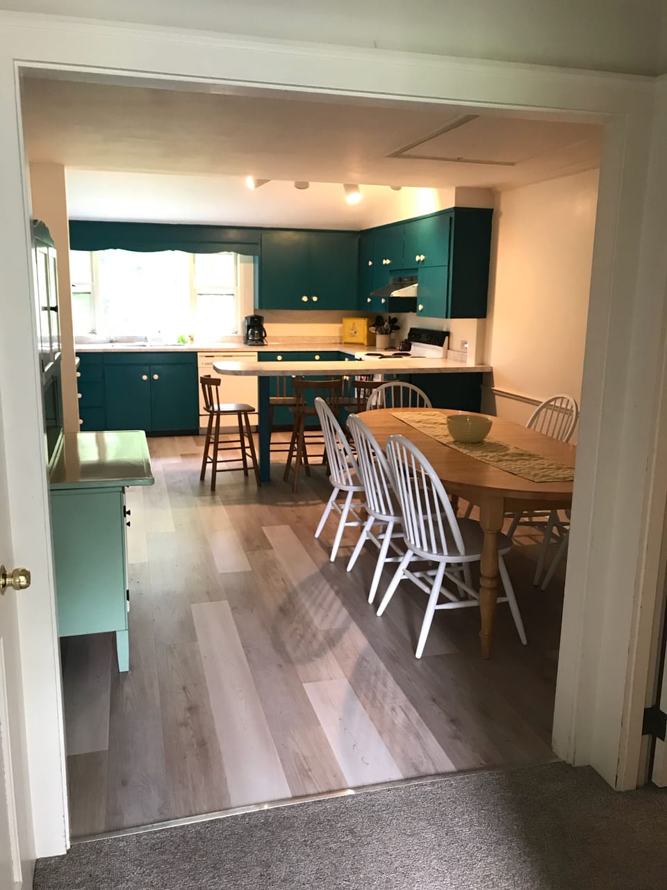 Large kitchen and dining area. Screened in porch is off the kitchen. 