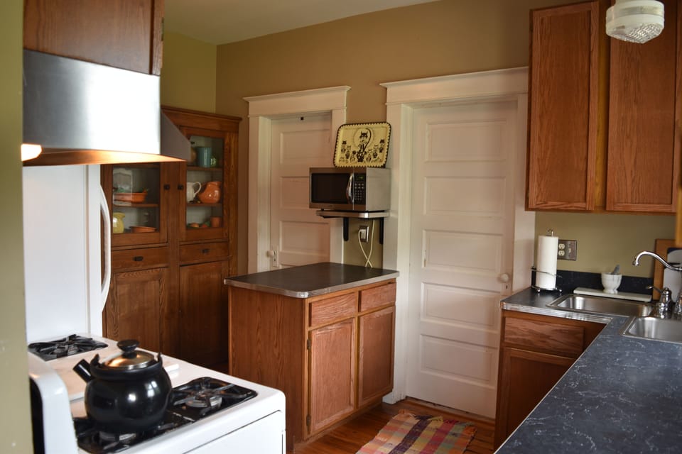 Kitchen with Fiesta dishes that say lets eat in....