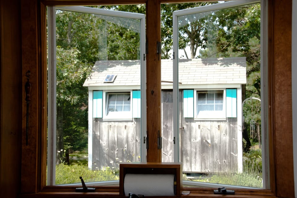 The recycling shed, and Kathy's garden, from the kitchen window.