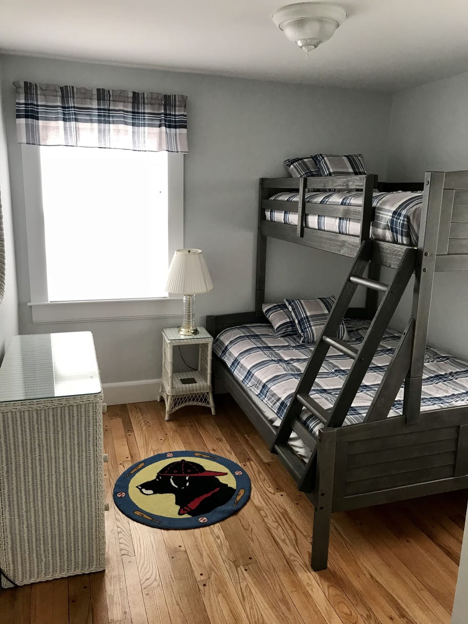 Third bedroom with new twin over full bunk bed, window treatments and paint.