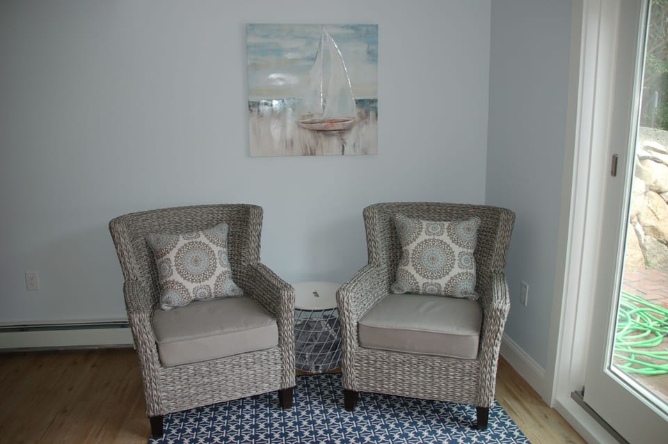 Cozy conversation area in renovated basement with sliders to patio area