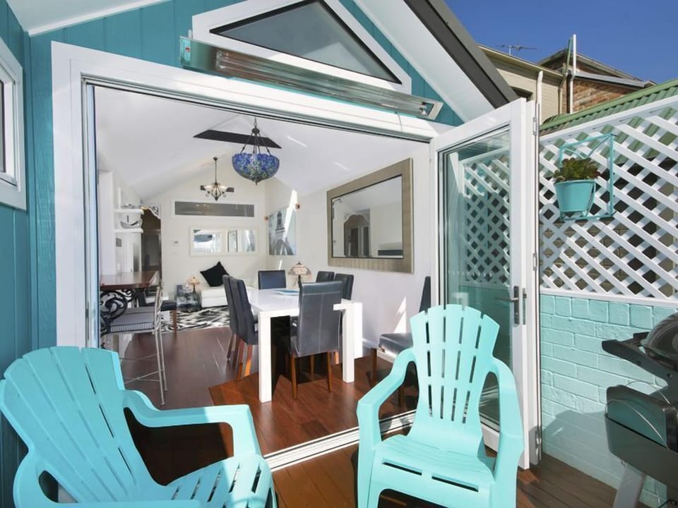 Bi-fold doors open onto the private deck