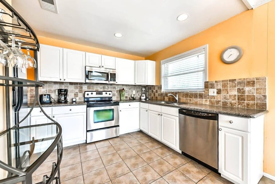 Kitchen with Granite Countertops & Updated Stainless-Steel Appliances